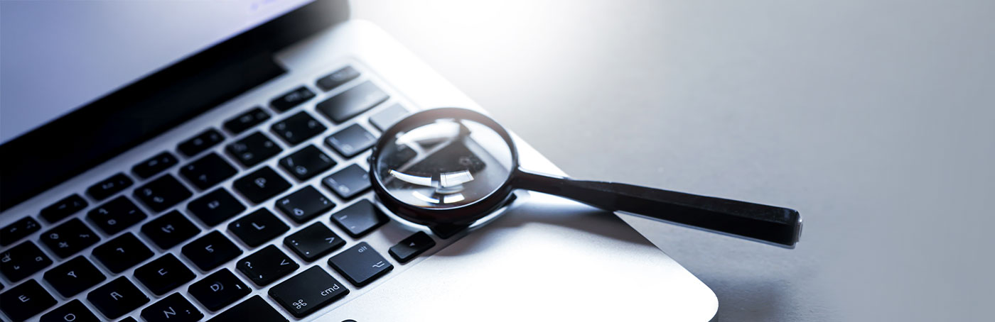magnifying glass on keyboard