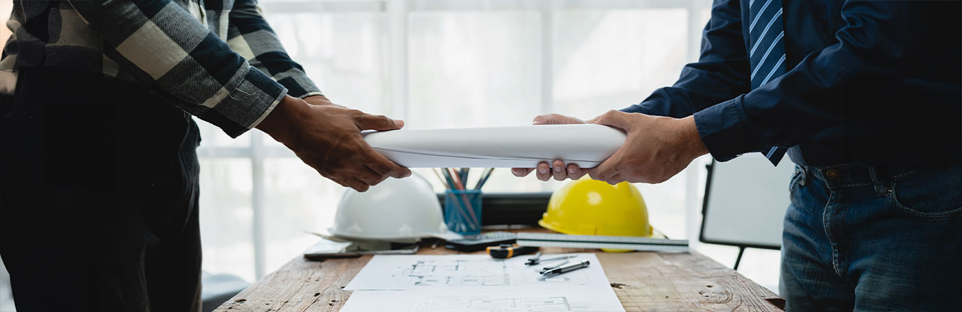 handing over blueprints